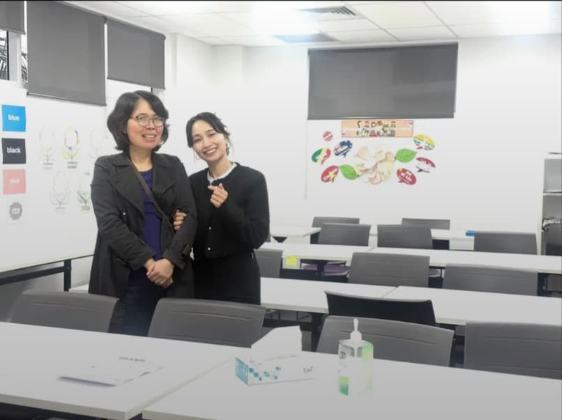 Teacher Changchang in a classroom with a colleague