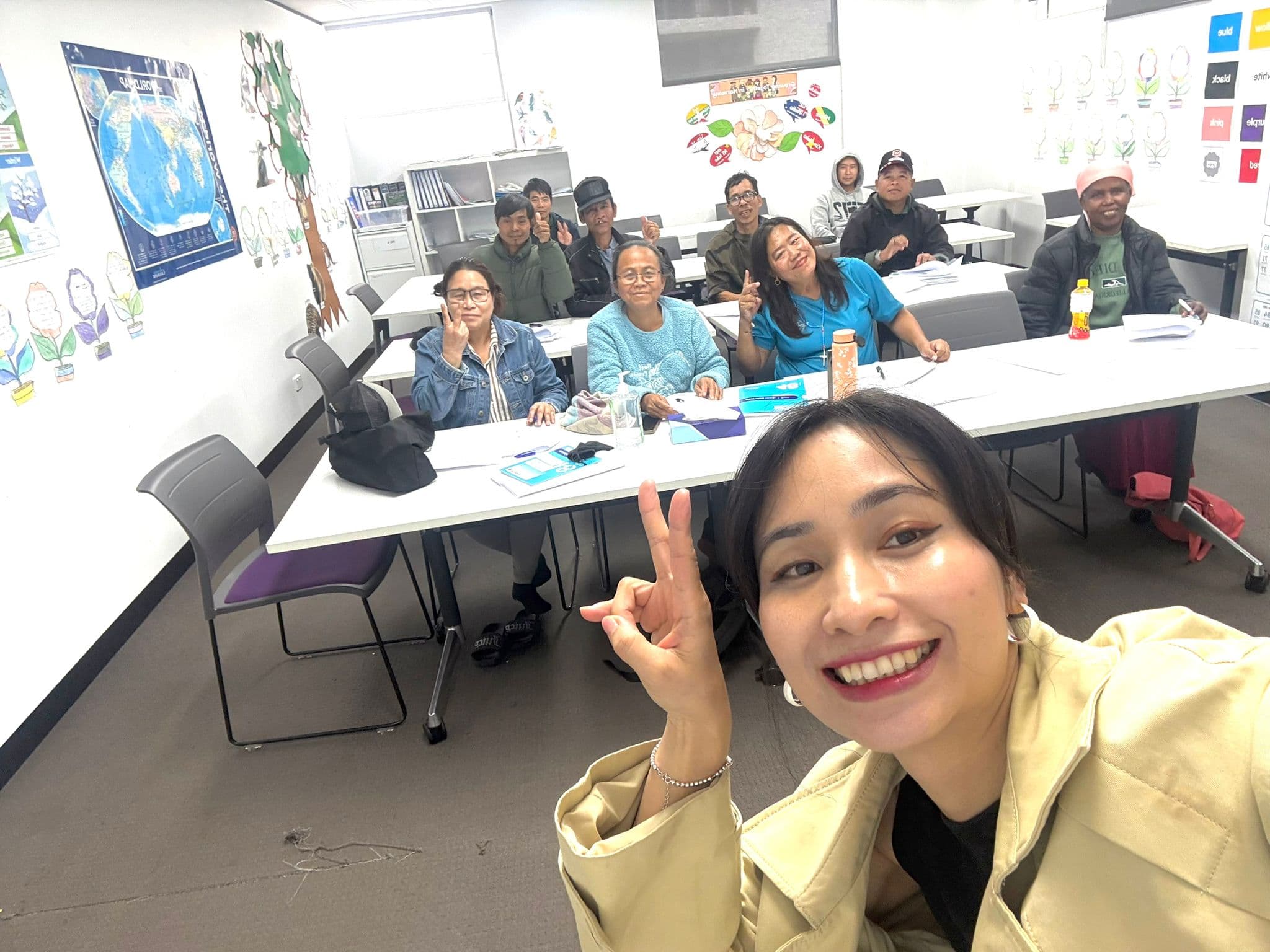 Teacher Changchang with adult English students in class
